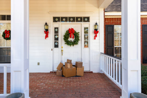 istock Mail Order packages on front porch during the holiday season 1207968138