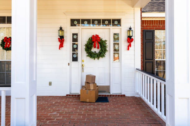 istock Mail Order packages on front porch during the holiday season 1207968153