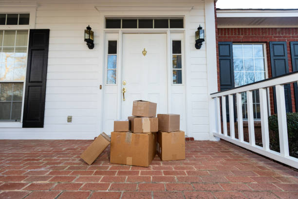 istock Boxes in front of door to home 1207968404