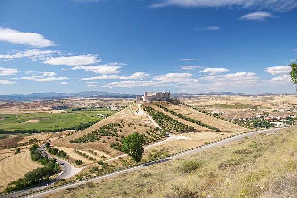 Consuegra, Spain - July 13, 2022: Consuegra is a municipality located in the province of Toledo, Castile-La Mancha. La Mancha region is famous for its extensive dry plains, vineyards, and historical constructions such as windmills.