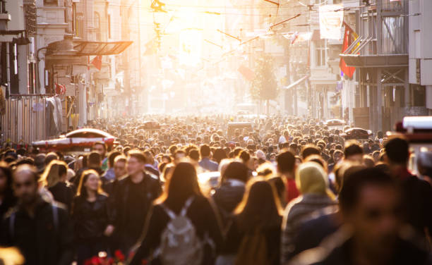istock Blurred crowd of unrecognizable at the street 1207970838