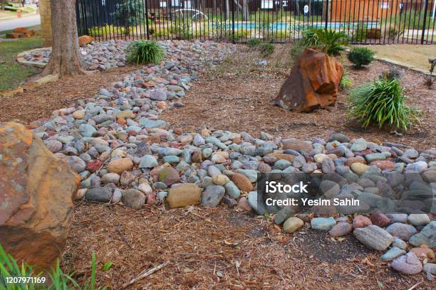 Landscaped Garden With Decorative Stones Rocks And Plants Stock Photo - Download Image Now