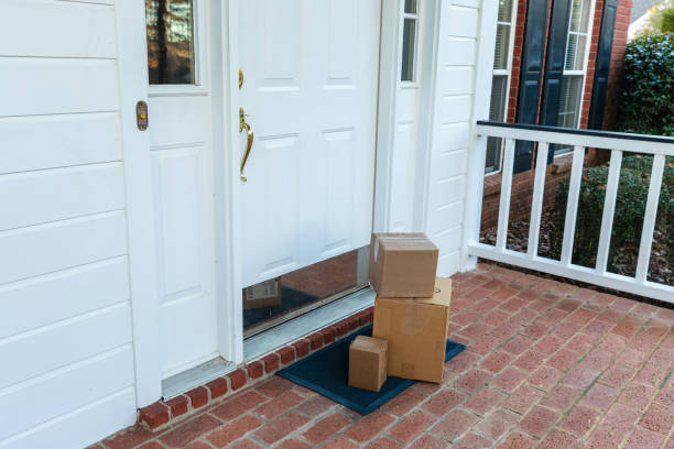 Merchandise delivery from online ordering Shipping boxes on front porch of home front porch stock pictures, royalty-free photos & images