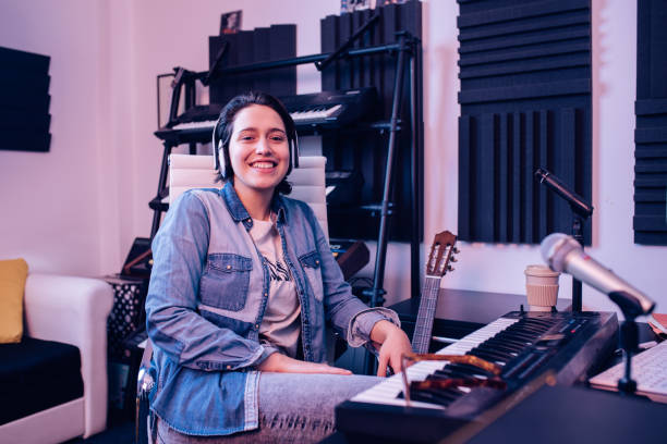 istock Young musician at the recording studio 1207972609