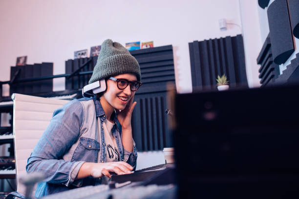 istock Young DJ mixing music in the studio 1207972662