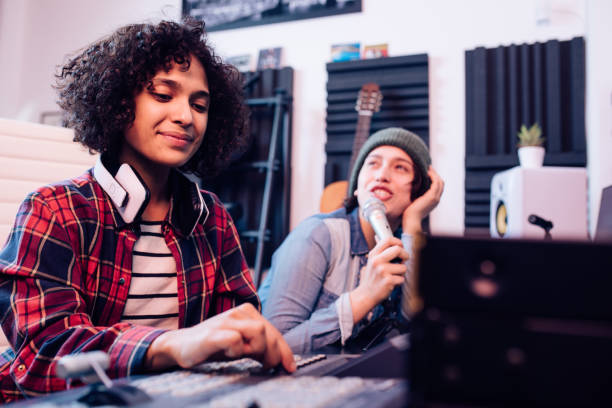 istock Girls making a song in the music studio 1207973217