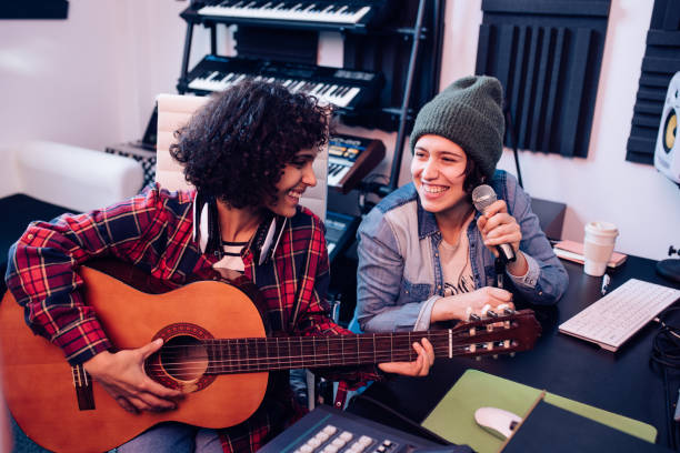 istock Girls band working in the studio 1207973228