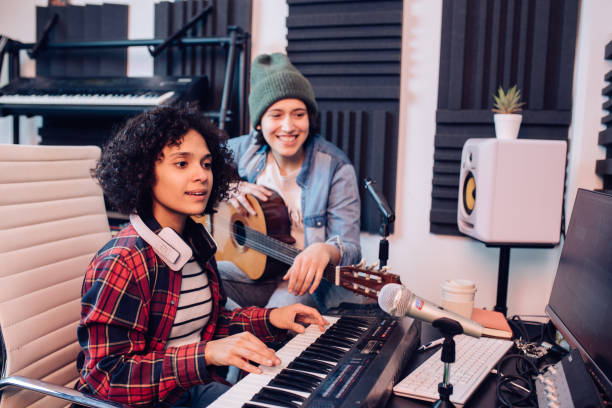 istock Young female musicians creating music in the studio 1207973236