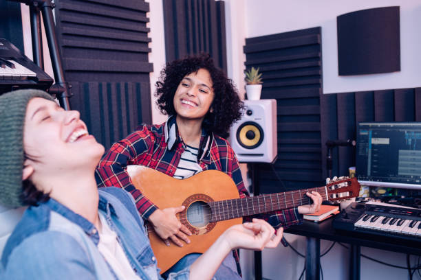 istock Two inspired musicians making music in the studio 1207973238