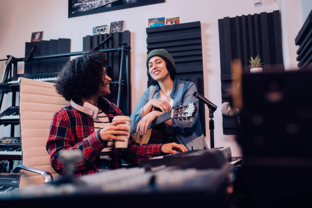 istock Two young musicians working at the sound recording studio 1207973240