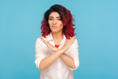 Never, no compromise! Portrait of dissatisfied hipster woman with fancy red hair crossing hands, showing x sign