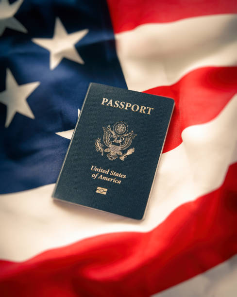 istock US passport on the american flag 1207973487