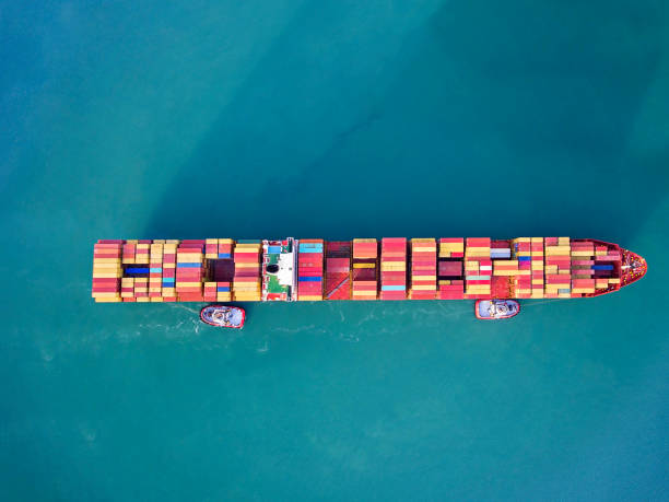 istock Aerial view of container freight ship carrying container box for import and export business logistic. 1207973562