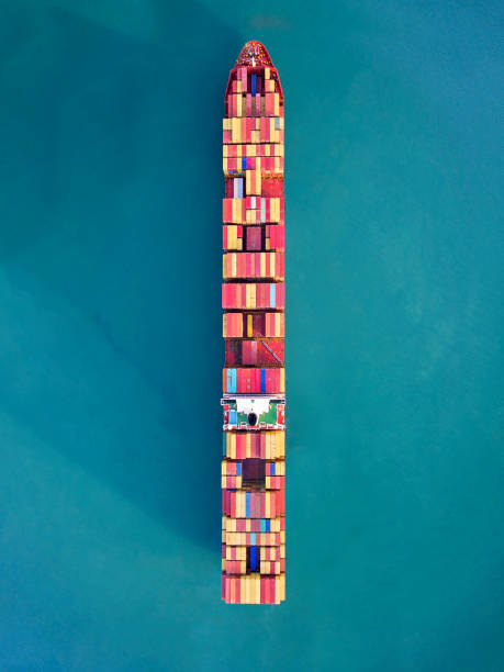 Aerial view of container freight ship carrying container box for import and export business logistic in ocean. Aerial view of container freight ship carrying container box for import and export business logistic in ocean. industrial ship photos stock pictures, royalty-free photos & images