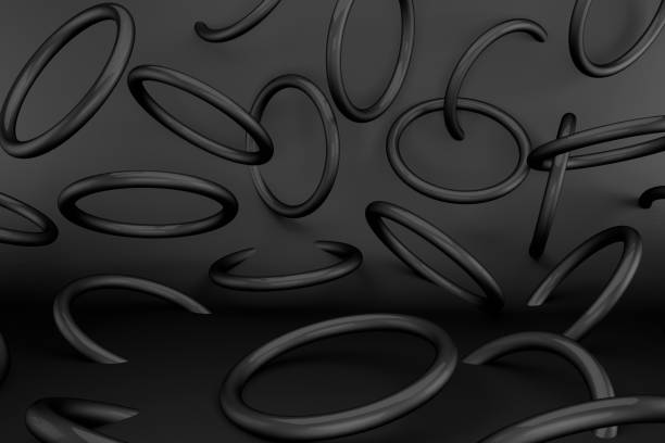 istock 3d render black rings torus on a black background. Abstract geometric shapes. Minimalist concept 1207975697