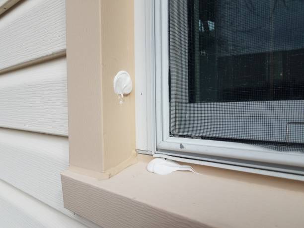 istock filled holes in window frame with glass window 1207976981
