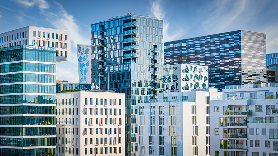 Panorama of Modern Urban Cityscape of Downtown Oslo, the capital city of Norway. Modern Architecture Business Buildings and Skyscapers under blue summer sky. Oslo City Center, Norway, Scandinavia