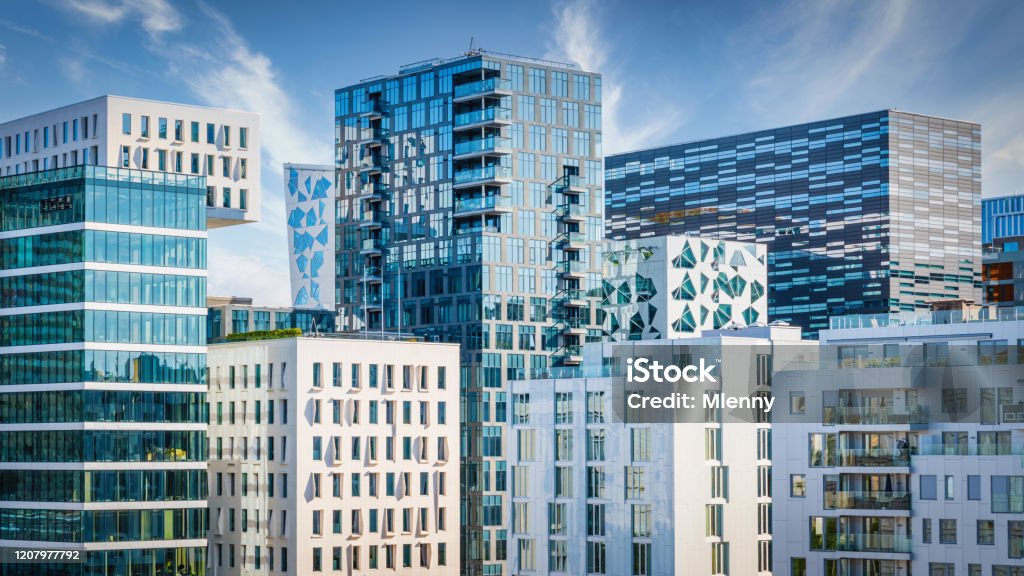 Oslo Modern Architecture Urban Skyline Panorama Norway Panorama of Modern Urban Cityscape of Downtown Oslo, the capital city of Norway. Modern Architecture Business Buildings and Skyscapers under blue summer sky. Oslo City Center, Norway, Scandinavia Oslo Stock Photo