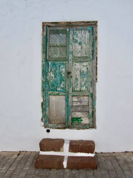 Old disused wooden green door stock photo