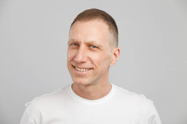 istock middle-aged man headshot in a white t-shirt 1207979198
