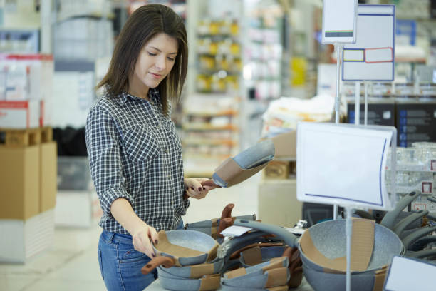 istock Pretty woman buy at hardware store 1207979644