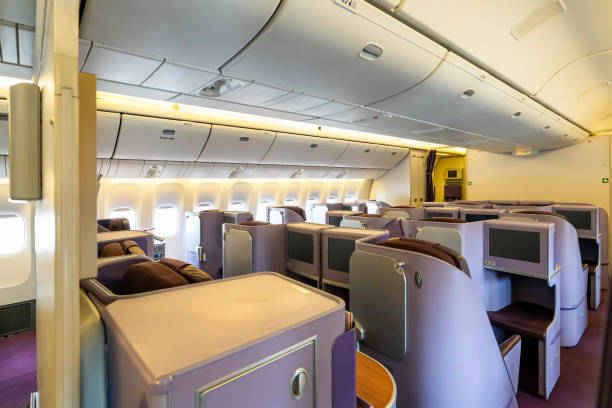 istock Modern empty Interior in the airplane or passenger plane while parking view from rear 1207979795