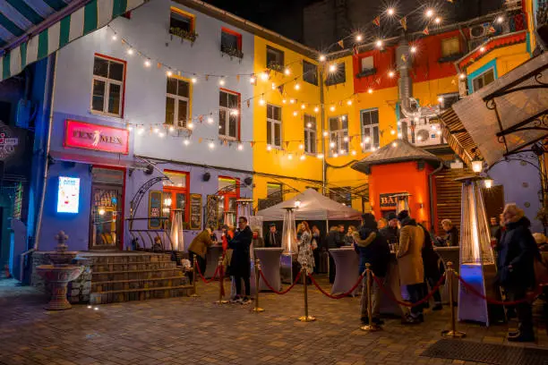 Photo of A small restaurant and bar in a cosy street in Mexico.