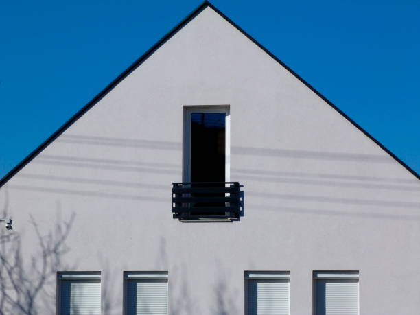 istock modern white stucco house exterior with french balcony 1207982805