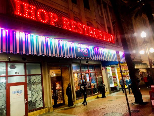 IHOP on Bourbon Street New Orleans, Louisiana, USA, February 2020: people walk outside the IHOP restaurant on Bourbon Street in the French Quarter. Ihop stock pictures, royalty-free photos & images