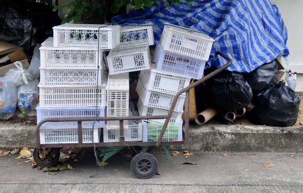 Hand Truck Loading Pile of Plastic Crates