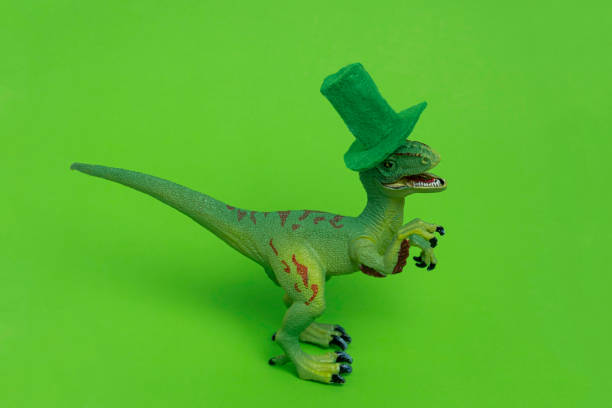 istock cute st. Patrick card with dinosaur wearing green felt hat 1207988167