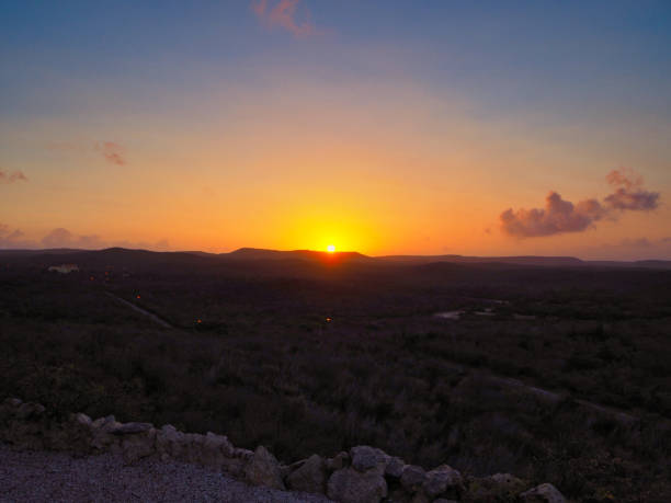 Sunset over Vuracao, hills, farmhouses, some clouds