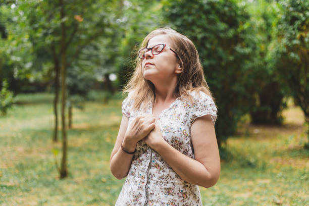 istock Woman with chest pain suffocating 1207990638