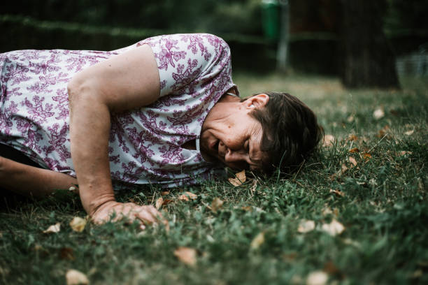 istock Old woman struggling to stand up 1207990795