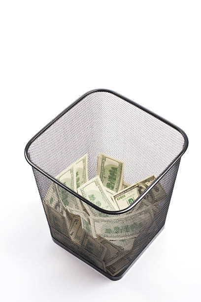 istock Cash in the Recycle Bin 120799251