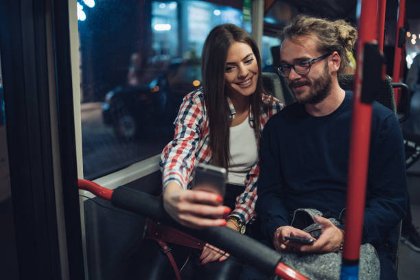 istock Friends taking selfie in the bus 1207996818