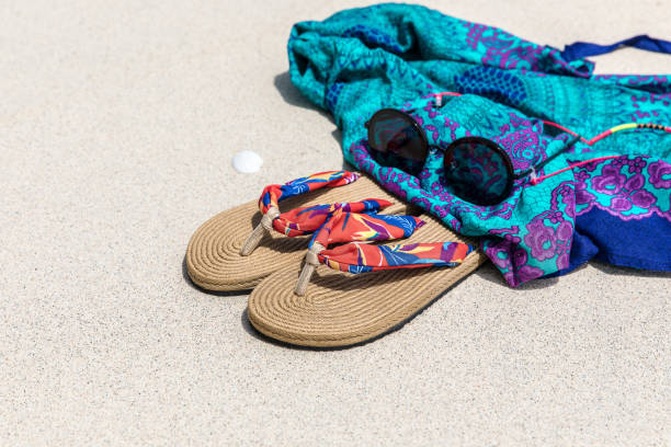 Slippers and Summer background sand background summer slippers and Coral Color Pareo Sunglasses in Gili Trawangan, Indonesia. gili trawangan stock pictures, royalty-free photos & images