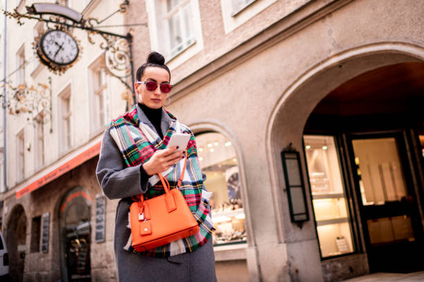istock A modern woman using a smart phone while visiting the foreign city alone 1208000892