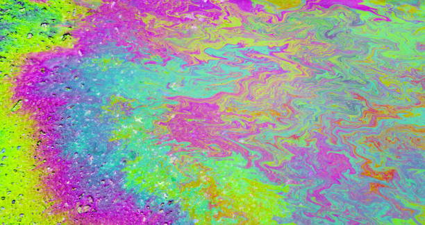 istock Petrol on the asphalt a big polluted puddle water. 1208007999