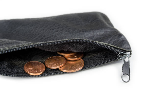 istock Dollar and coins in a shabby wallet. Poverty concept 1208009357