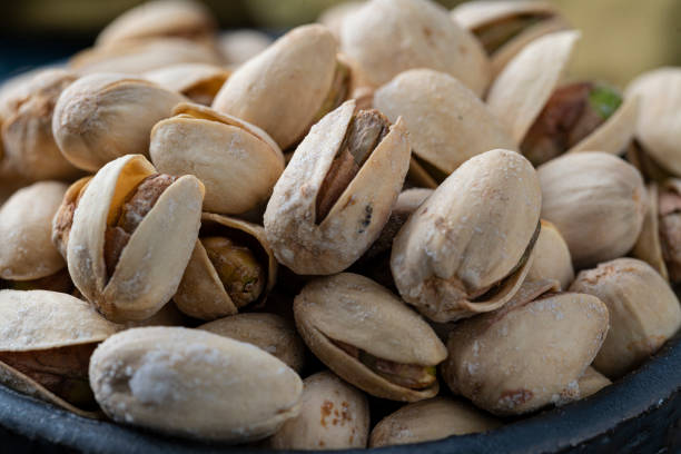 istock Roasted And Salted Pistachios In Ceramic Bowl 1208010066