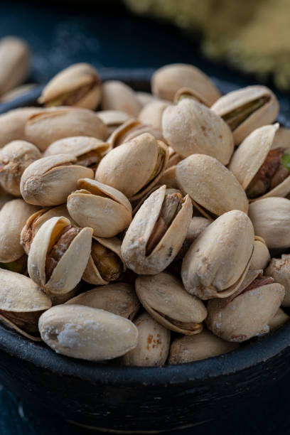 istock Roasted And Salted Pistachios In Ceramic Bowl 1208010193