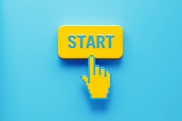 Hand Shaped Computer Cursor Clicking over A Yellow Push Button: Start Written on Push Button Hand shaped computer cursor clicking on a yellow computer button on blue background. Start is written on push button. Horizontal composition with copy space. New business concept. beginnings stock pictures, royalty-free photos & images