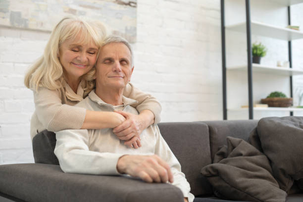 istock Happy elderly couple enjoying time at home 1208010733