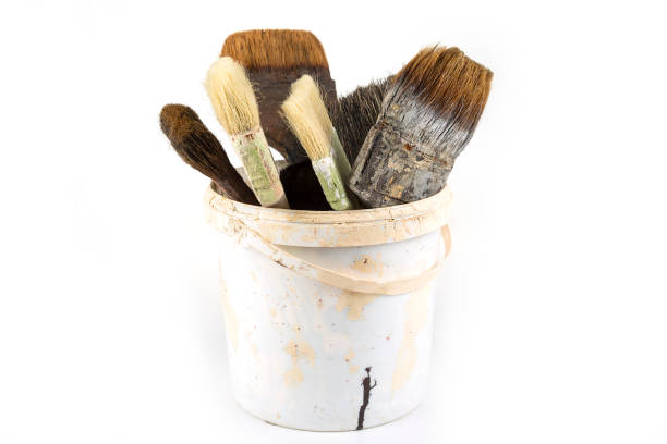 istock Old used paint brushes in the bucket 1208011961