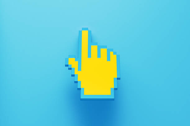 Yellow Pixelated Hand Cursor Sitting on Blue Background Yellow pixelated hand cursor sitting on blue background. Horizontal composition with copy space. cursor photos stock pictures, royalty-free photos & images