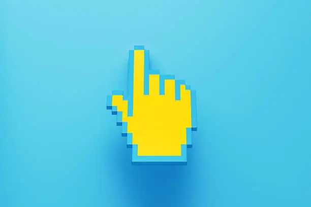 Photo of Yellow Pixelated Hand Cursor Sitting on Blue Background