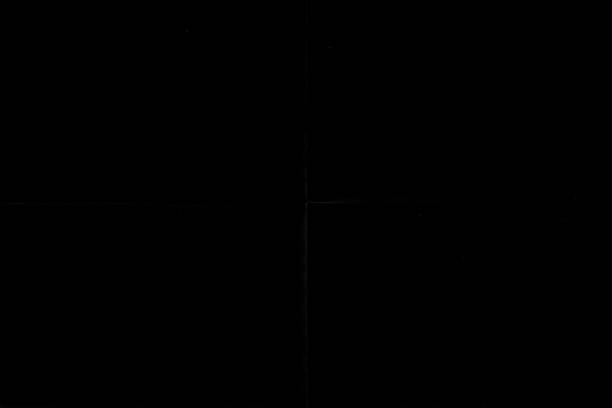 istock black crumpled paper texture with folds, black background, wallpaper. 1208012335