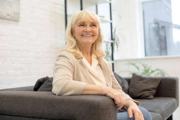 istock Smiling elderly woman enjoying her weekend at home 1208013351