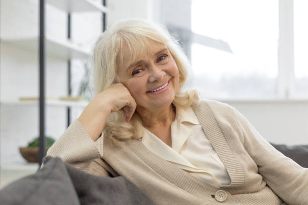 istock Smiling elderly woman enjoying her weekend at home 1208013436